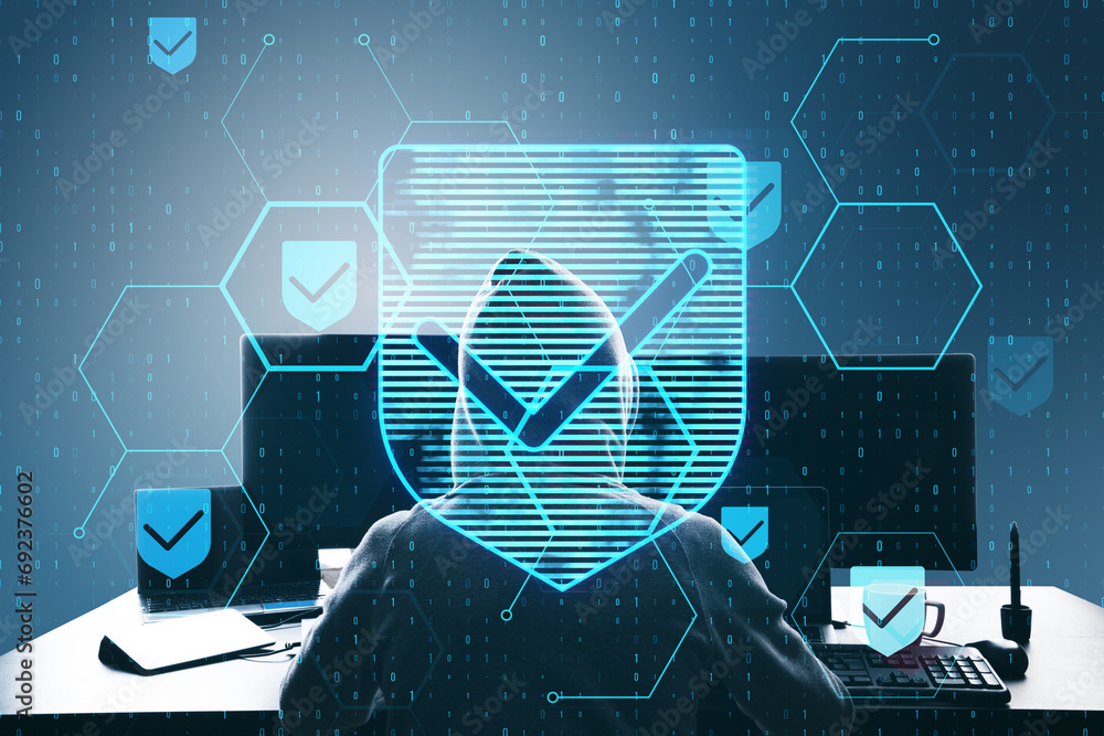 Poster Hacker at desktop using laptop with glowing hexagonal shield hologram with binary coding on blurry background. Safety, hacking, malware and internet concept. Double exposure.