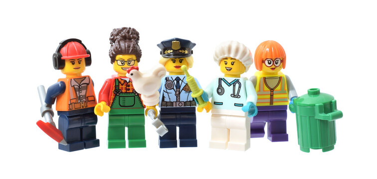 Lego minifigures of girls police officer, worker, firefighter in uniform. Editorial illustrative image of gender equality in job to international women's day