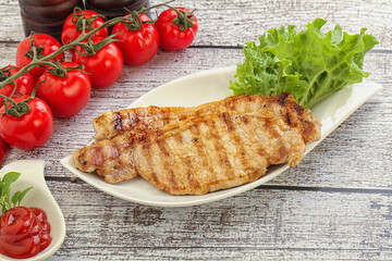 Grilled pork steak with ketchup