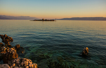 Dusk at the island of San Marino off the Adriatic coast of Novi Vinodolski, Primorje-Gorski Kotar...