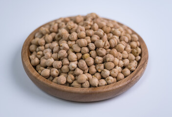 
Chickpeas, beans, wooden plate, close-up, white background