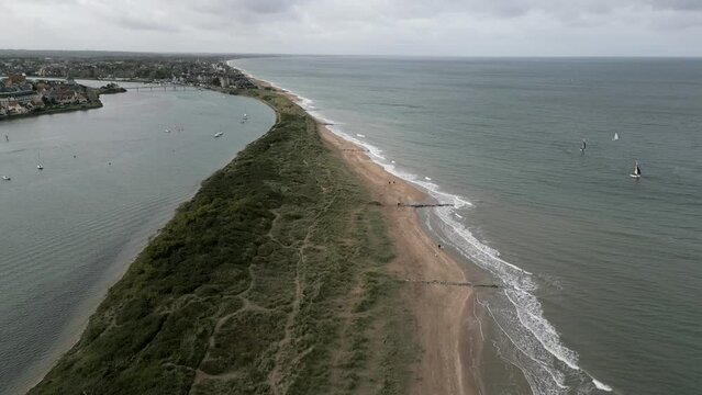 Normandy, France. 11-01-2023. Aerial view dunes separate the river from the sea. Cabourg city. Video 4K