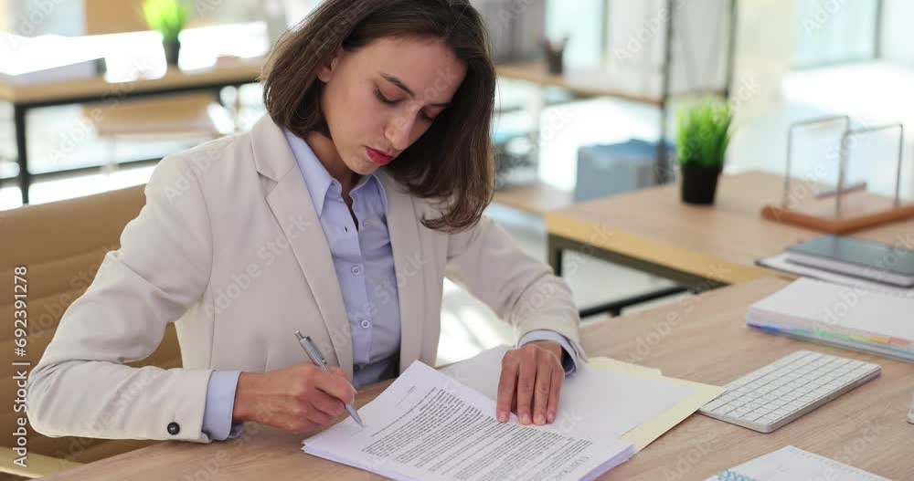 Wall mural successful businesswoman signs business contract in office