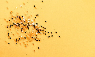 Gold Stars on Yellow Background. Star Sparkles and Shine Background for Holiday Greeting Concept.