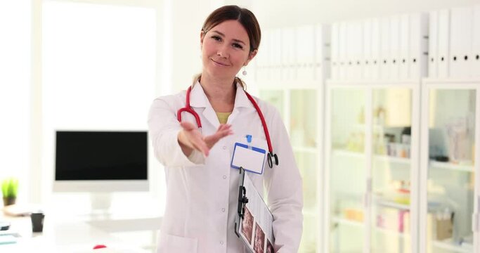Doctor extends hand and invites you to come to clinic