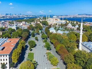 Drone view of the park, Hagia Sophia and the city in the background on a sunny day in Istanbul, Turkey.