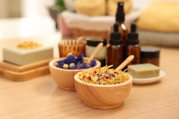Dry flowers on wooden table indoors, space for text. Spa time