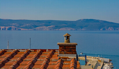 A view of the port area over the rooftops in Novi Vinodolski, Primorje-Gorski Kotar County,...