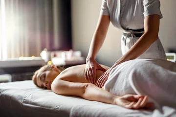 Zelfklevend behang Massagesalon Young happy Caucasian woman relaxing with hand massage at beauty wellness spa salon