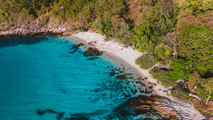 Koh Samet Island Thailand, aerial drone view from above at the Samed Island in Thailand with a turqouse colored ocean and a white tropical beach on a sunny day