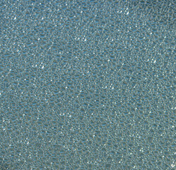 background of embossed transparent blue glass.