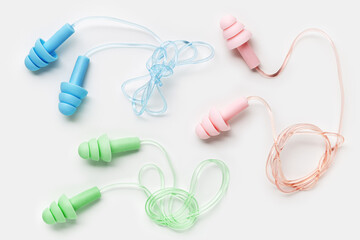 Reusable silicone colorful earplugs, for swim, sleep, rest as minimal trend pattern on white...