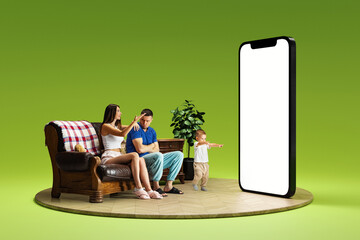 Family arguing. Man and woman sitting couch and looking on 3D model of mobile phone with empty...