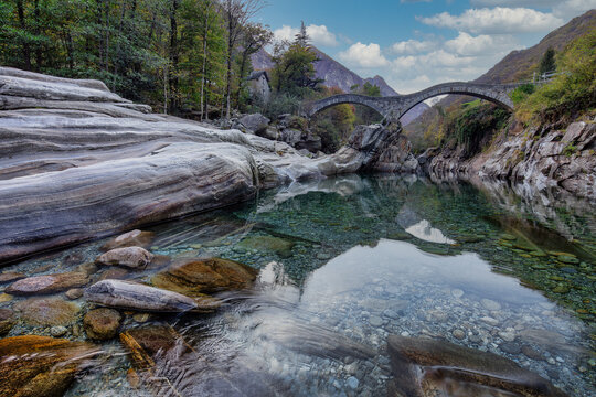 The Historic Ponte dei Salti Bridge Over the Crystal-Clear Verzasca River, Switzerland.