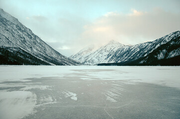 Snow-covered winter mountain lake, Russia, Siberia, Altai mountains. Multinskie lakes.