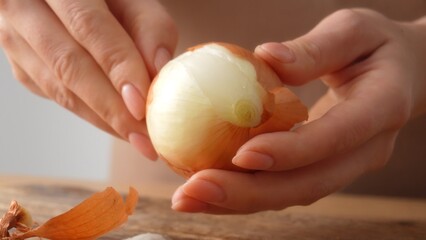 Woman Peels Onion Layers with her hands. Close-up, shallow dof.