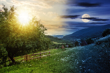 Fototapeta na wymiar rural landscape with sun and moon at twilight. fence near the apple tree on a hillside meadow. summer solstice day and night time change concept. mysterious countryside scenery in morning light