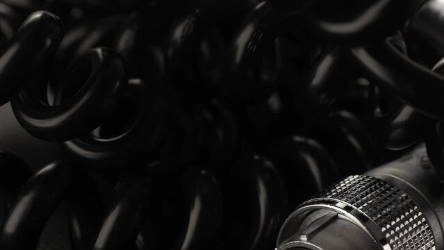 Rotating Tangled Power Cables with Connectors for Studio Equipment. Close-up, shallow dof.