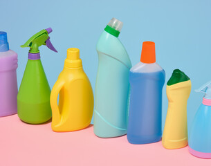 Lots of colorful bottles of cleaning products. Cleaning service concept.