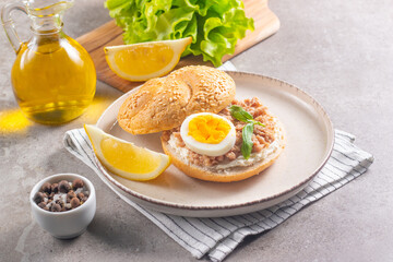 Delicious tuna open sandwiches. Buns with canned tuna, lemon, cream cheese and boiled egg.