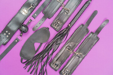 A set of erotic toys for BDSM (ball gag, cuffs, rope, flogger, collar and leash) for BDSM fantasy...