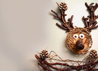 Craft work of a reindeer with Christmas decorations, space for text, Christmas card