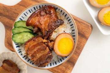 Braised pork belly meat over cooked rice, famous and delicious street food in Taiwanese restaurant.