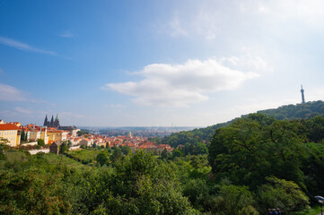 Fototapeta na wymiar Prague, Czech Republic - September 26, 2023 - View of the Prague skyline while climbing Petrin Tower.