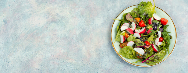 Light spring salad with vegetables and greens.
