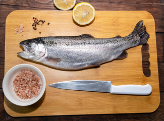 Wild rainbow trout on a cutting board.