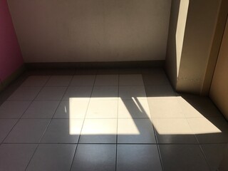 empty room with floor and shadow from window