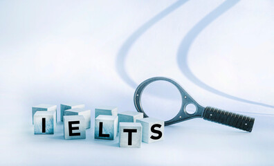 IELTS symbol. Concept words International English Language Testing System IELTS on a wooden block.