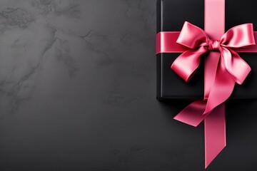 black gift box with pink bow with copy space