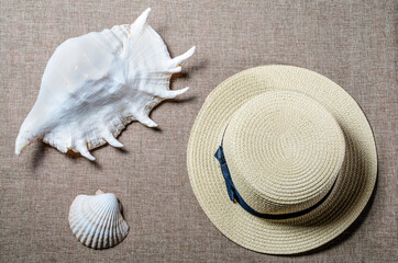 vacation flat view with straw hat and sea shellssea shells