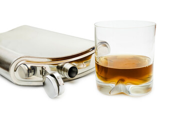 Flat metal flask and whiskey glass on white background