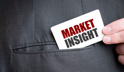 Card with MARKET INSIGHT text in pocket of businessman suit. Investment and decisions business...