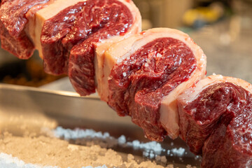 Indulge in a visual feast of mouthwatering rodizio preparation and succulent picanha cuts at our vibrant steakhouse