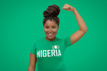 Cheering football supporter from Nigeria with green jersey