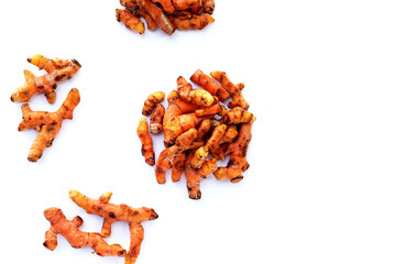 Turmeric roots on white background.