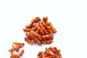 Turmeric roots on white background.