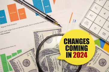 changes coming in 2024 on yellow sticker with pen and calculator