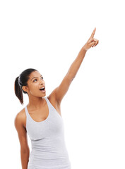 Pointing up, fitness and woman with promotion, surprise and wellness isolated on a white studio background. Person, hand gesture and model with exercise, decision and choice with sports or shocked