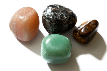 set of polished mineral stones on white background
