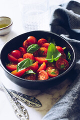 Healthy salad with cherry tomatoes and basil
