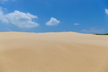 Fototapeta na wymiar Sand dune and blue sky view.