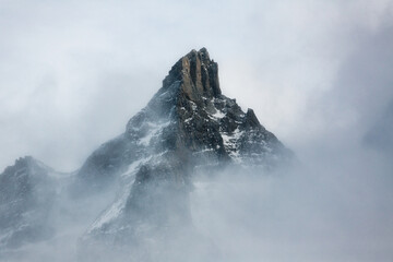 Fototapeta na wymiar snow covered foggy mountain