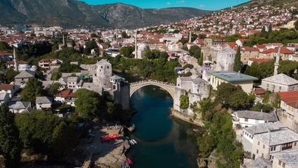 Papier Peint photo Stari Most Whispers of History: Mostar's Riverside Elegance and the Neretva's Tale