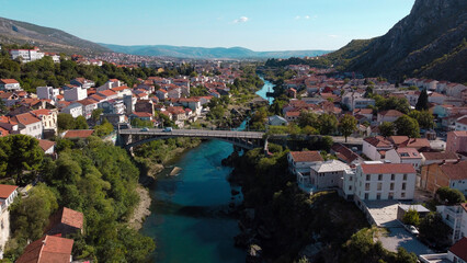 Fototapeta na wymiar Neretva Serenity: A Captivating Glimpse of Mostar's Riverside Charm
