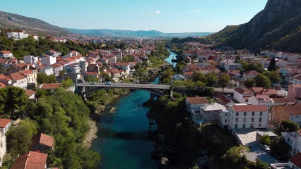 Fotobehang Stari Most Neretva Serenity: A Captivating Glimpse of Mostar's Riverside Charm