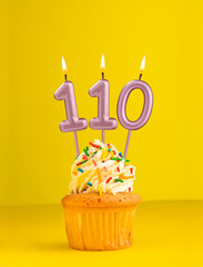 Birthday candle number 110 - Invitation card with yellow background